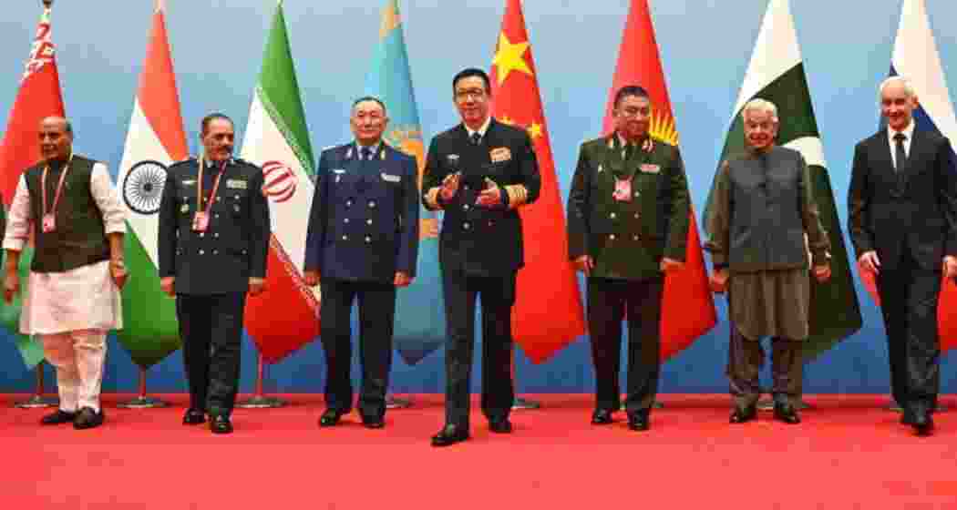 Defence ministers from SCO member states, including Russia and Iran, pose for a group photograph at the Qingdao summit, marking China’s assertive role in shaping regional defence alignments.

