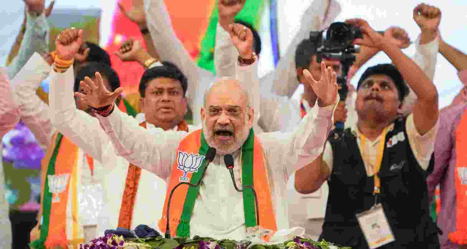 Union Home Minister and senior BJP leader Amit Shah addresses an organisational meeting of the party at Netaji Indoor Stadium in Kolkata, Sunday.