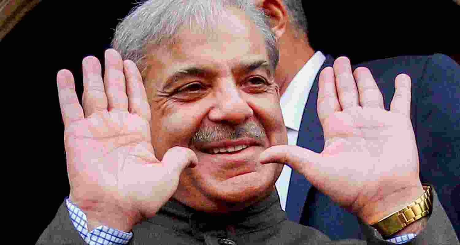 Shehbaz Sharif greeting the media.