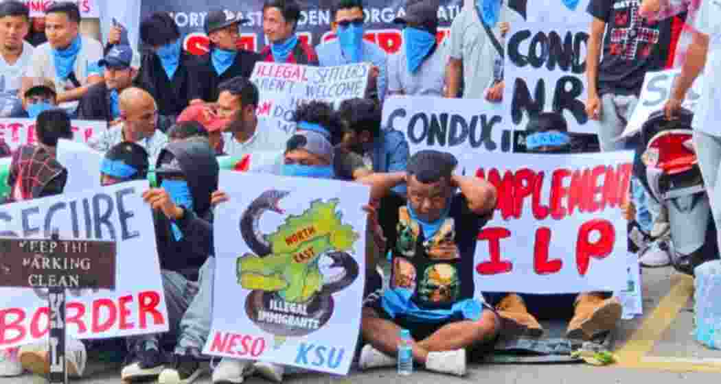 Hynniewtrep Youth Council members hold placards during a drive against undocumented workers at NEHU campus in Shillong on Friday. 