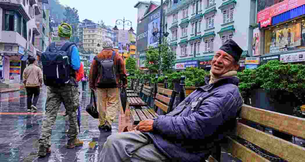 A man takes a moment of respite at the MG Road, the bustling heart of Gangtok, Sikkim's state capital.