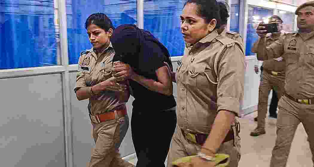 Police escort Sonam, the key accused, to the court for production in connection with the ongoing case.