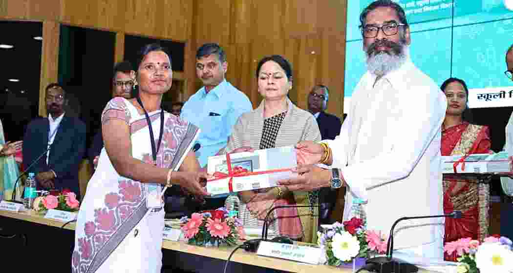 Jharkhand Chief Minister Hemant Soren and Chief Secretary Alka Tiwari present a tablet PC to a primary school teacher in Ranchi on Friday, advancing digital learning and education reforms in the state.