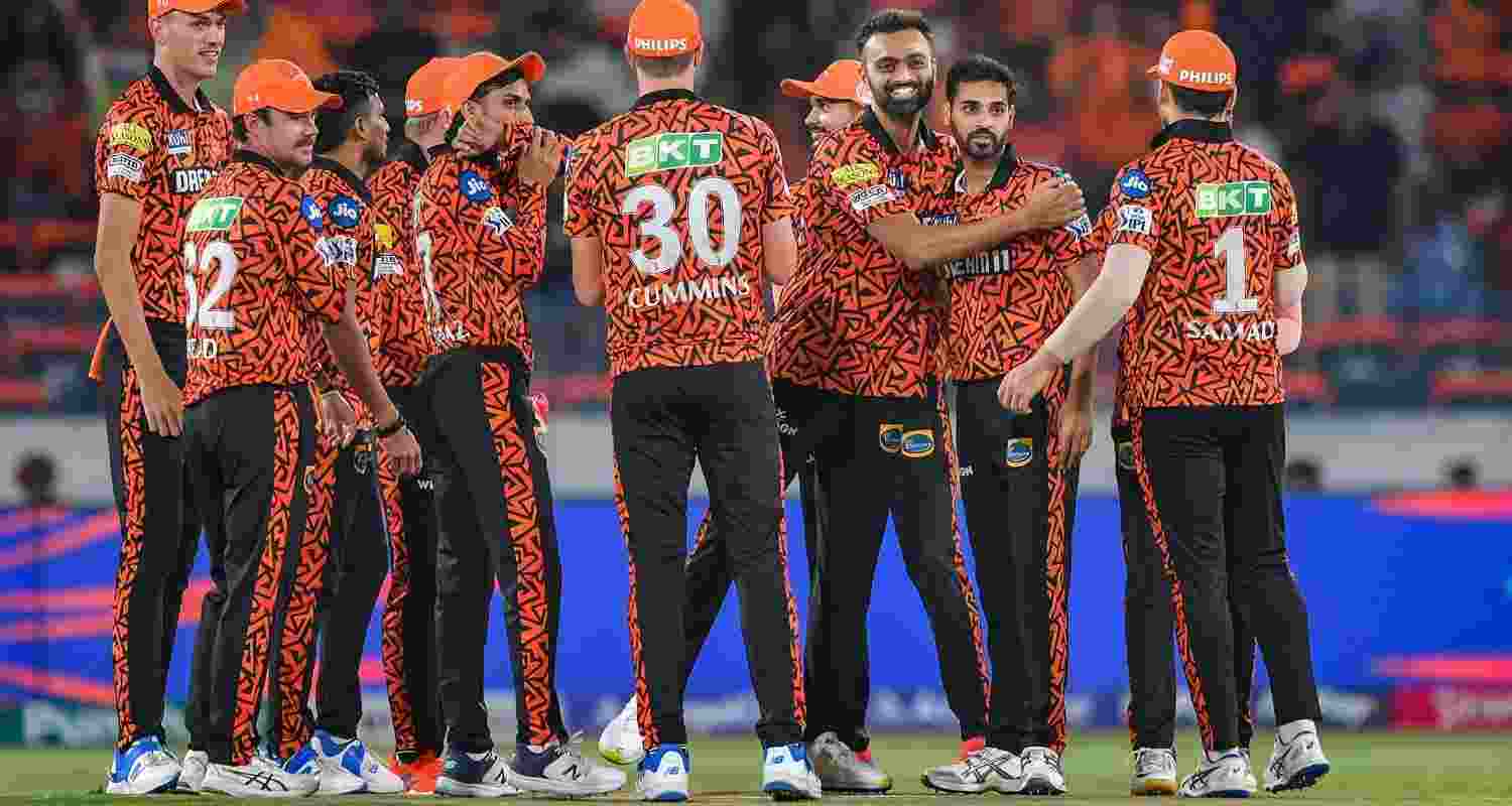  Sunrisers Hyderabad players celebrate the wicket of Rajasthan Royals batter Sanju Samson during the IPL 2024 T20 cricket match between Sunrisers Hyderabad and Rajasthan Royals at Rajiv Gandhi International Cricket Stadium, Uppal, in Hyderabad. 