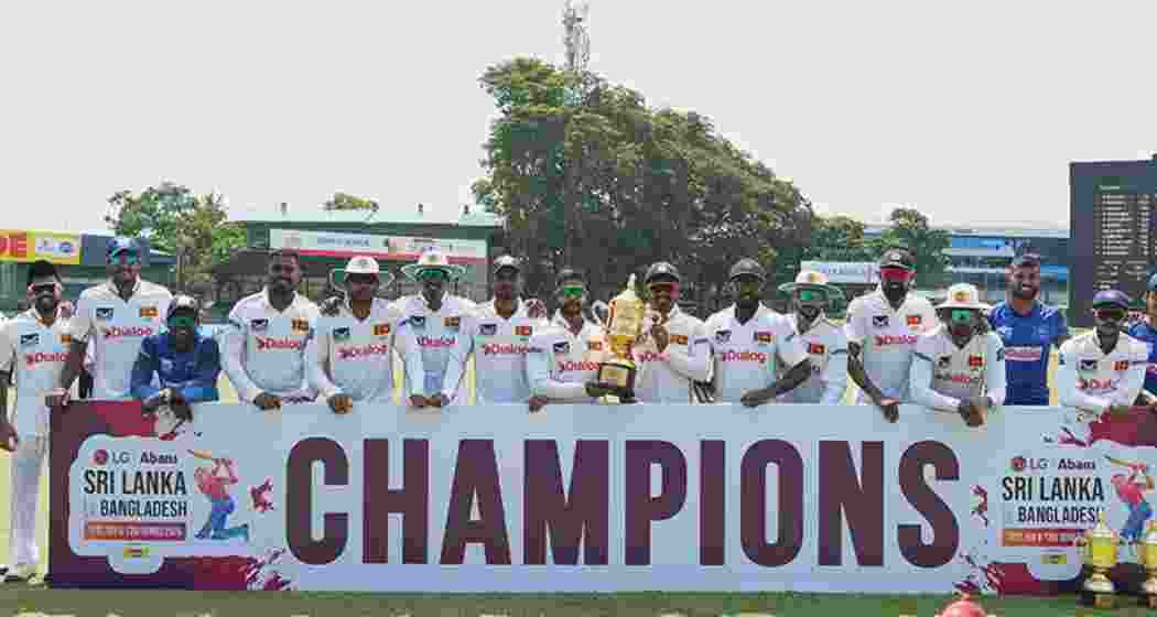 Sri Lankan players pose for a photograph after defeating Bangladesh by an innings and 78 runs on Day 4 of the Colombo Test on Saturday.