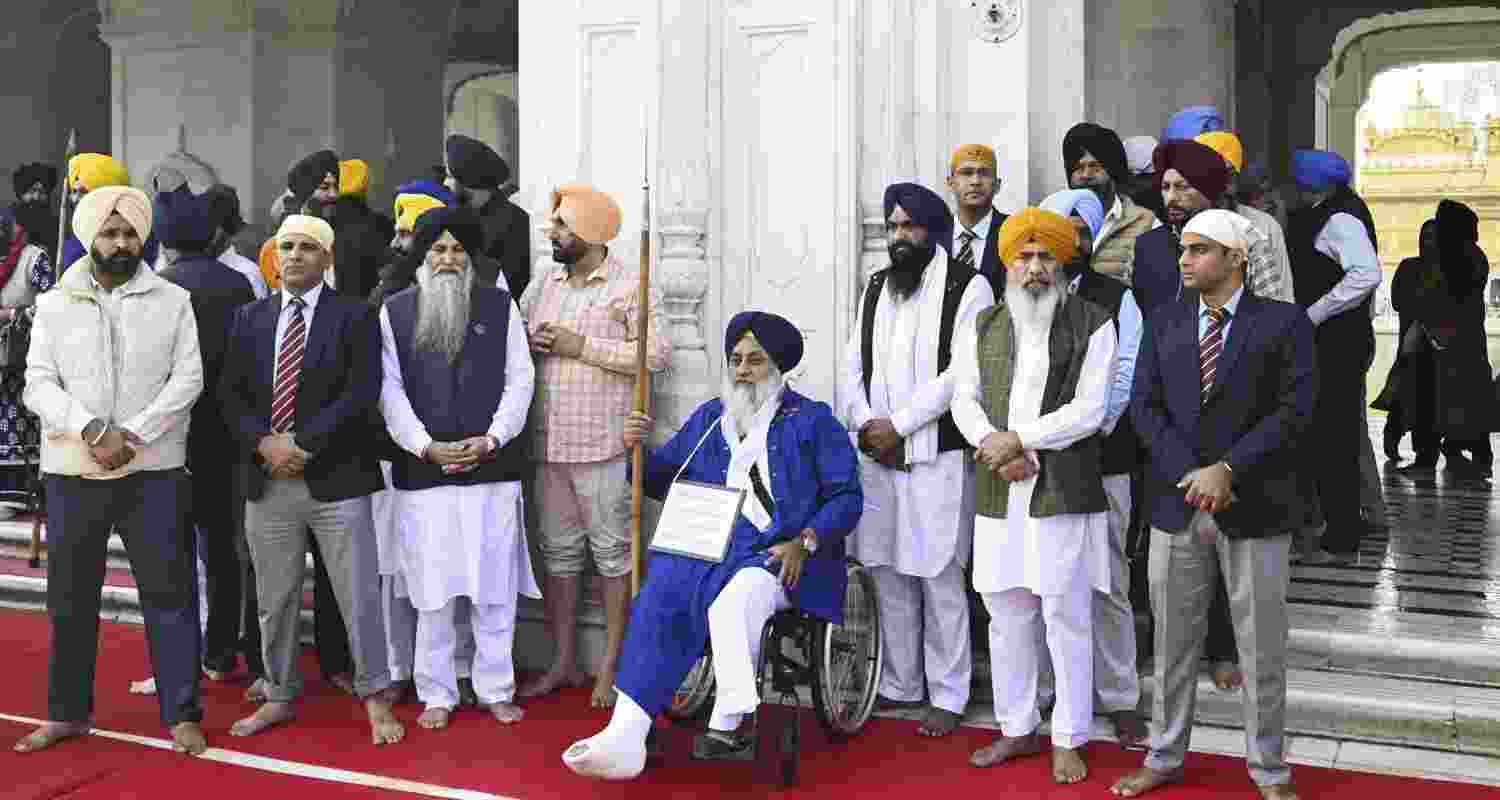 SAD leader Sukhbir Singh Badal servse the 'tankhah' (religious punishment) given to him by the Akal Takht, at Golden Temple in Amritsar, Tuesday.
