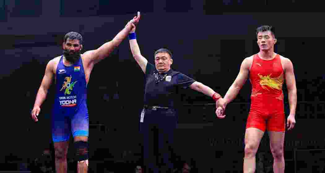 Sunil Kumar alongside his opponent after securing a bronze medal in the Greco-Roman 87kg category at the 2025 Asian Wrestling Championships, earning India’s first podium finish in the tournament.