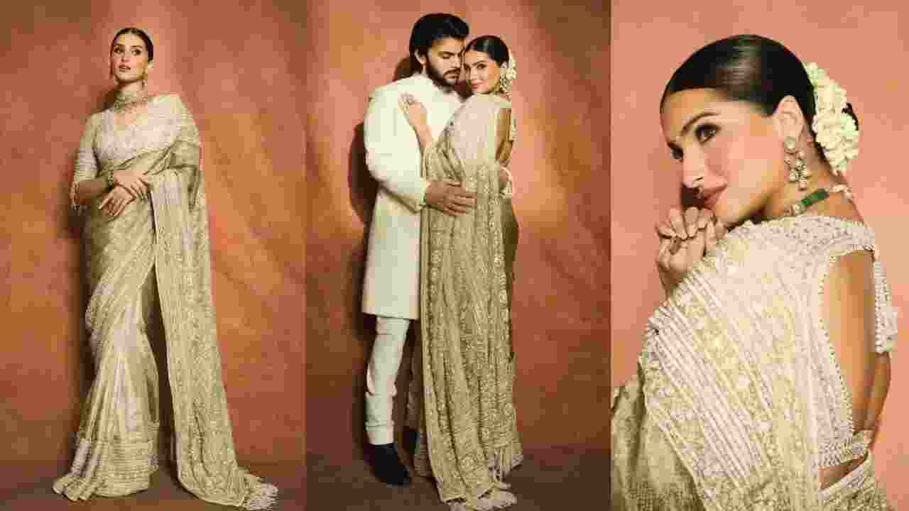 Tara looked regal in a heavy, hand-embroidered ivory tissue Kanjivaram saree as Veer twinned with her in a crisp ivory kurta-pyjama set.