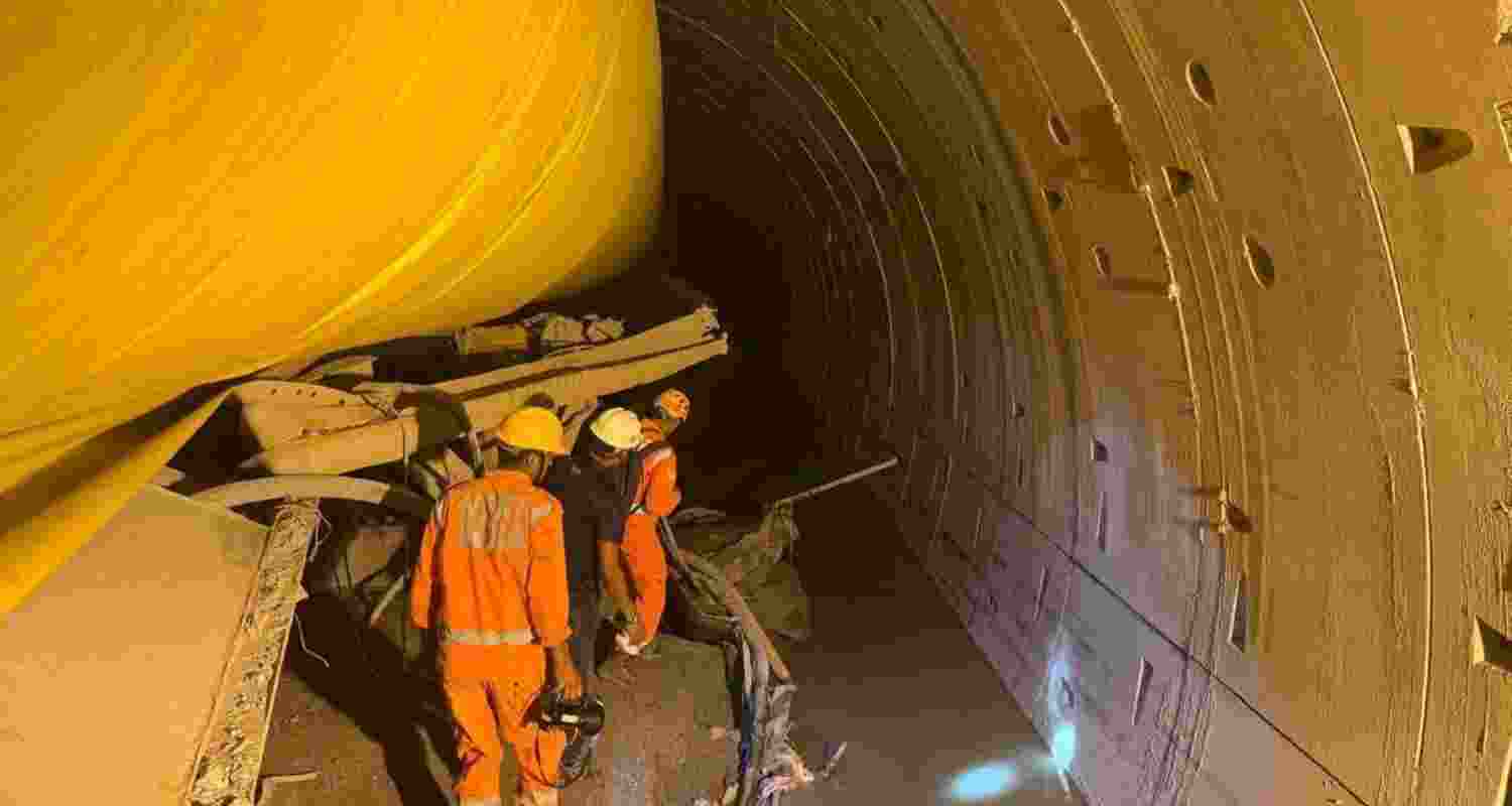 Rescue personnel inside the collapsed tunnel. Image via X.