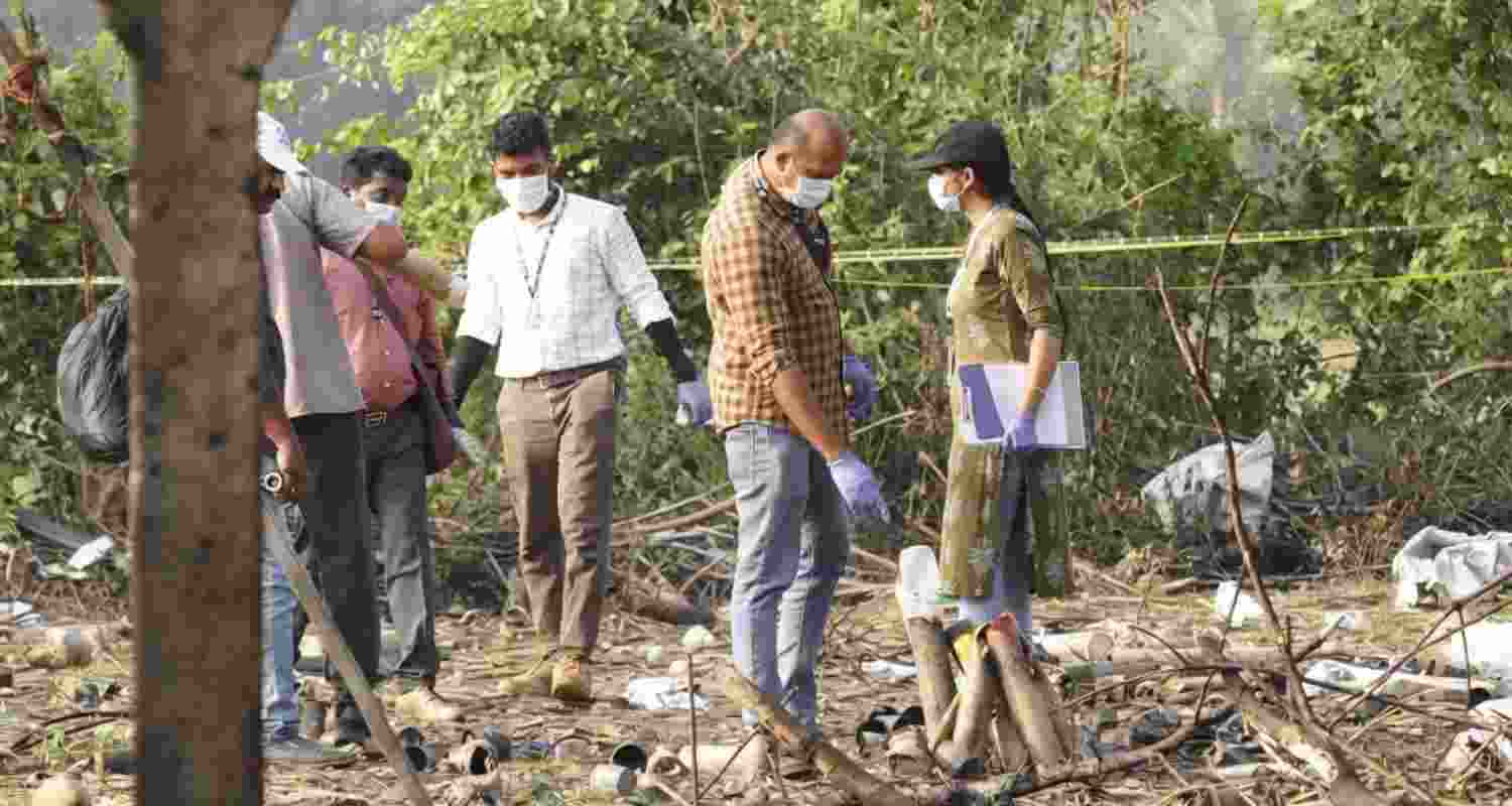 Forensic officials conduct a search operation after a blast at a fireworks manufacturing unit on Tuesday night, at Mundathicode in central Kerala's Thrissur district, Wednesday, April 22, 2026. At least 13 people were killed and several others were injured in the incident.