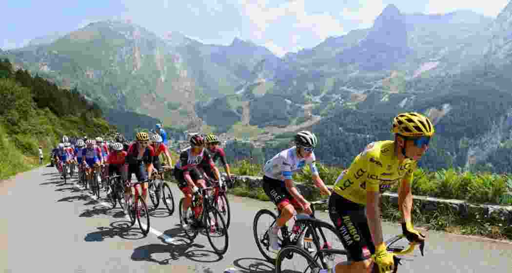 The Tour de France peloton during a past edition. The 2027 race will begin in Edinburgh, Scotland, marking its first Grand Départ in Britain since 2014, with stages in England and Wales.