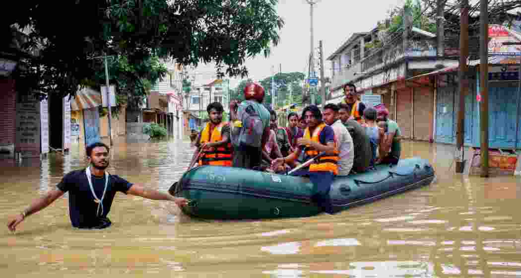 Flood-affected villagers are moved to a safer place after heavy rains at Baldakhal village on the outskirts of Agartala, Sunday, June 1, 2025. 