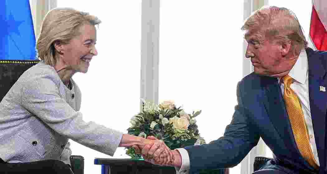 President Donald Trump and European Commission President Ursula von der Leyen shake hands after reaching a trade deal at the Trump Turnberry golf course. 