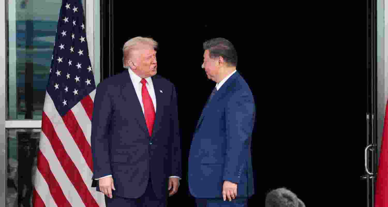 U.S. President Donald Trump and Chinese President Xi Jinping talk as they leave after a bilateral meeting at Gimhae International Airport, on the sidelines of the Asia-Pacific Economic Cooperation summit, in Busan, South Korea. (File Photo)
