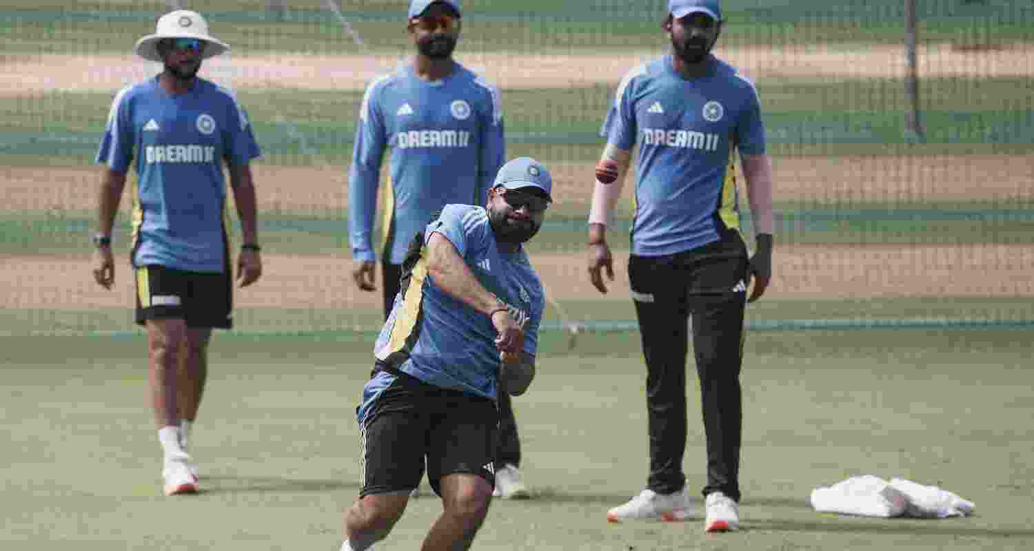 India's Rohit Sharma with teammates during a practice session ahead of the third Test cricket match against New Zealand, at Wankhede Stadium in Mumbai, Wednesday, Oct. 30, 2024