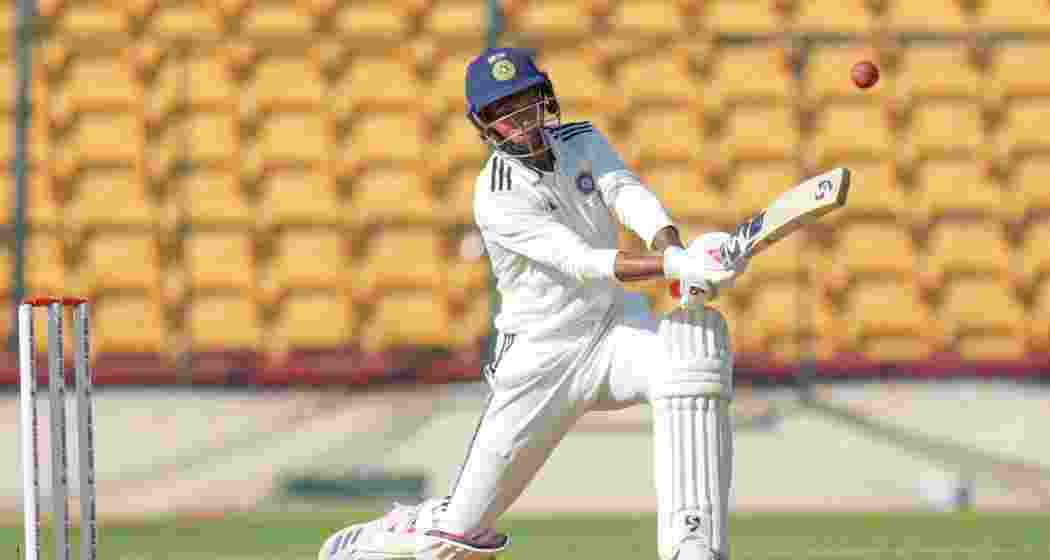 India B team player Navdeep Saini plays a shot during the first day of Duleep Trophy 2024 match between India A and India B teams, at Chinnaswamy Stadium in Bengaluru.