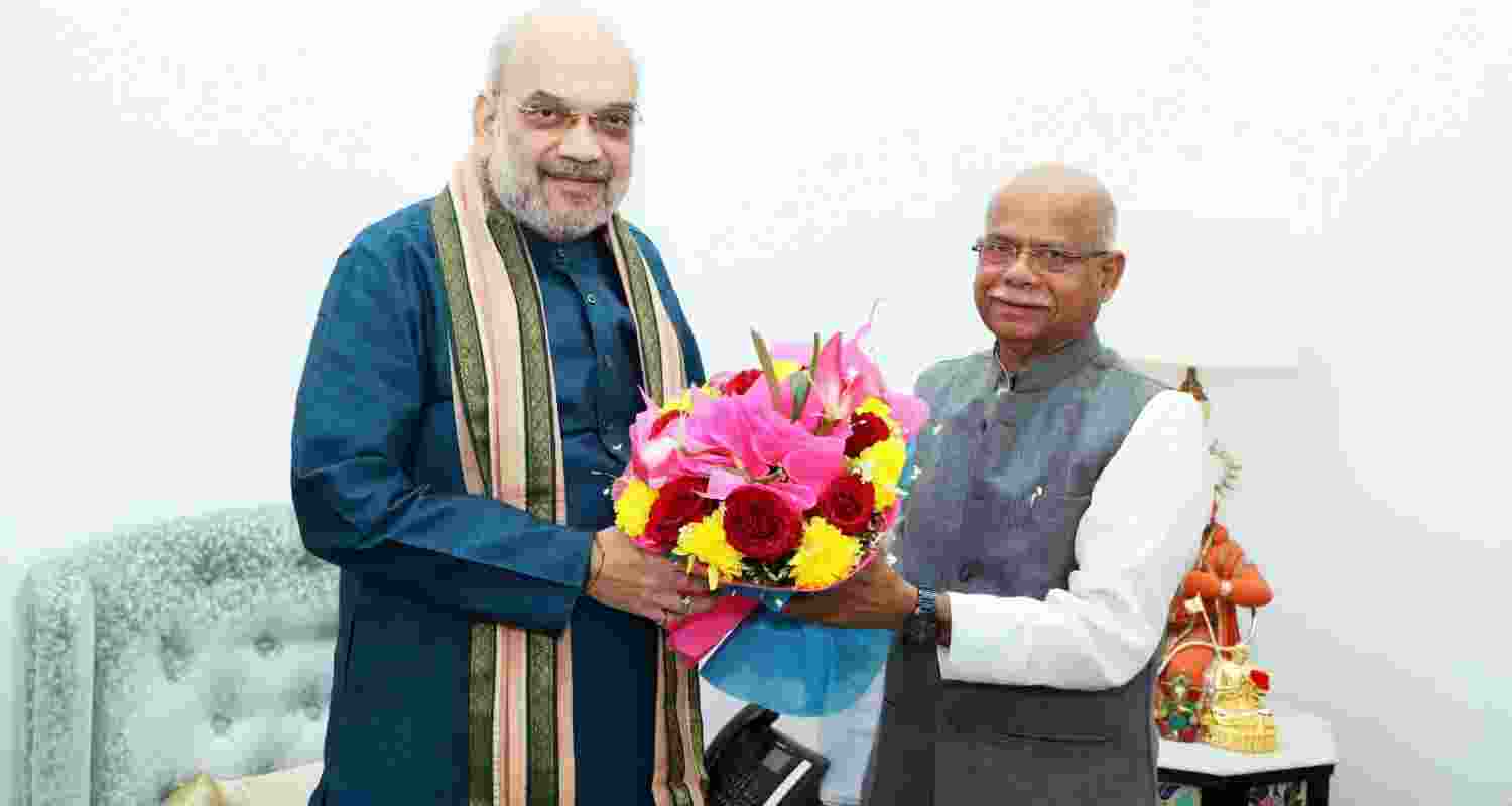 Amit Shah meets Himachal Governor Shiv Pratap Shukla. File Photo.