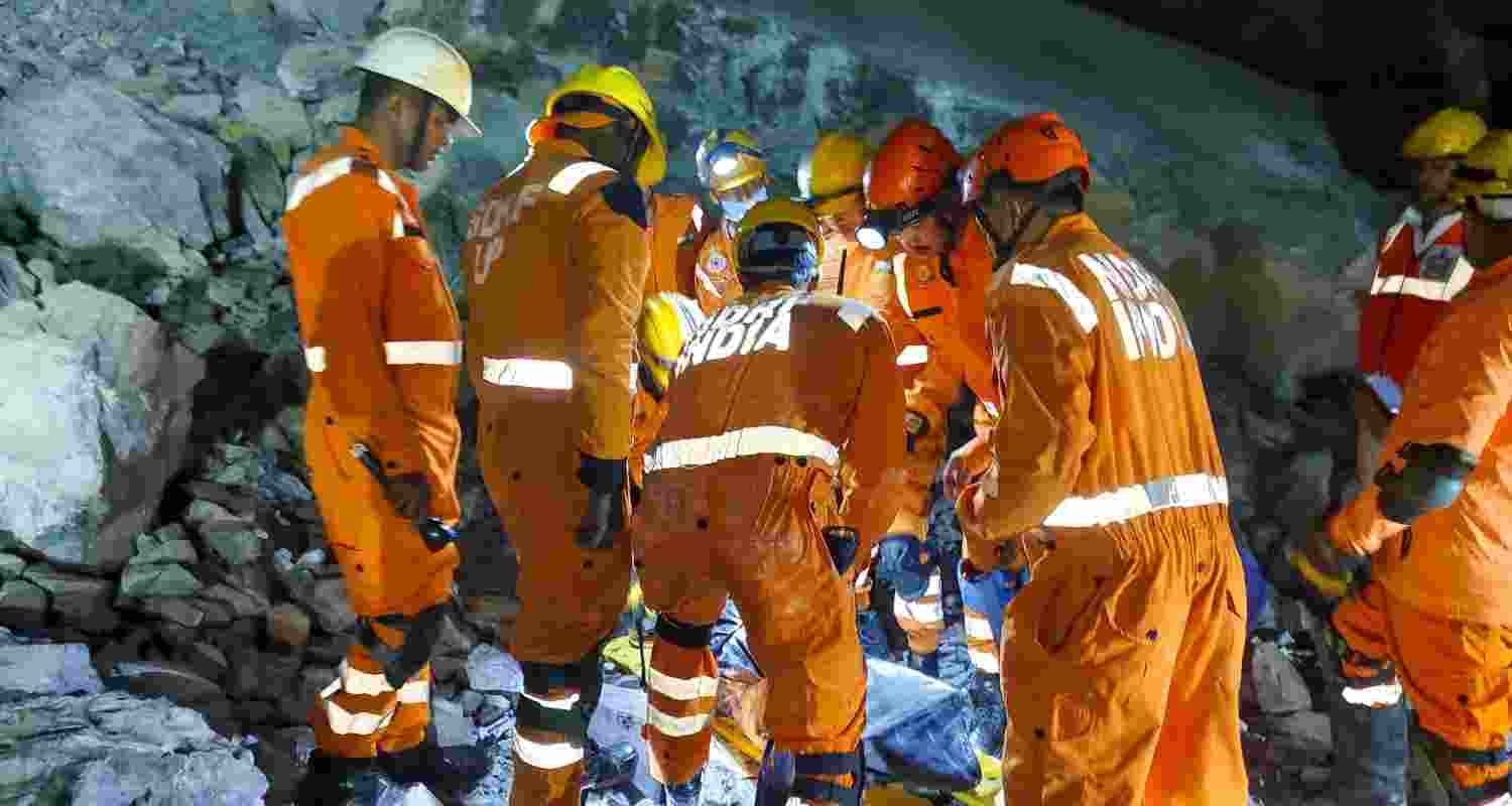 Members of the NDRF carry out a rescue operation at the site, after a portion of a stone quarry collapsed during a blasting activity near the Billi Markundi mining area in Sonbhadra district of Uttar Pradesh.