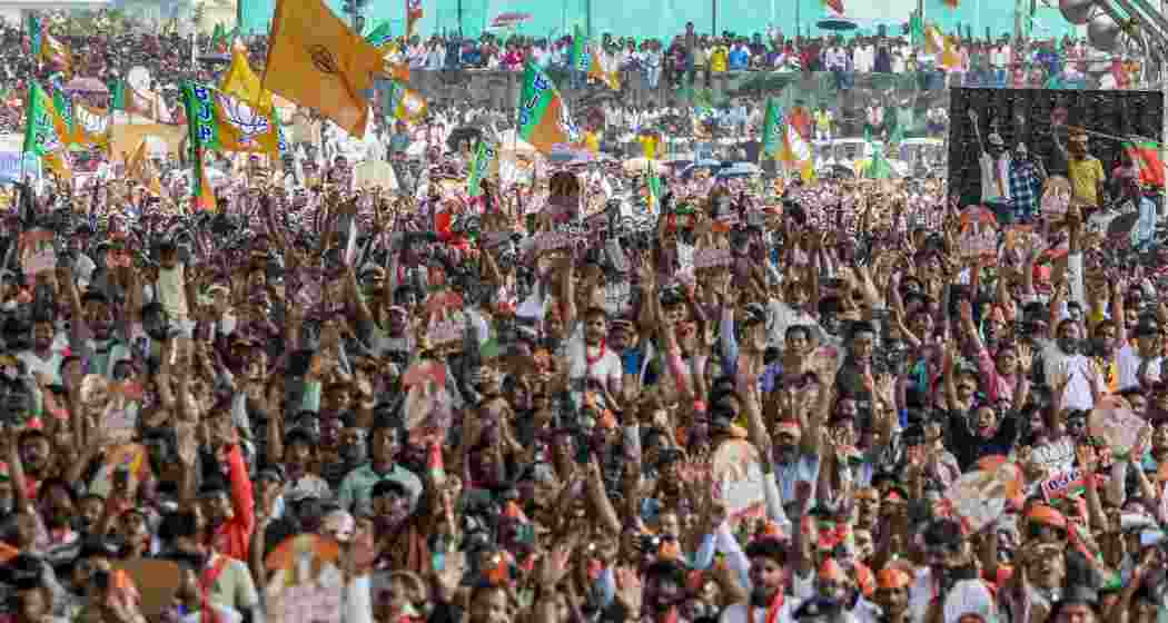  Supporters gather during a public meeting led by Prime Minister Narendra Modi ahead of the West Bengal Assembly elections, in Siliguri on Sunday. (narendramodi.in via PTI Photo)