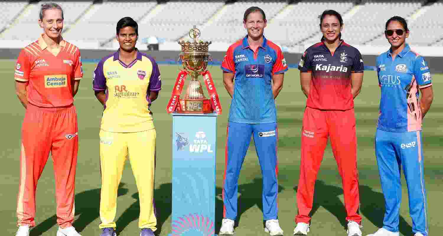 The five captains pose with the WPL trophy. Image via BCCI.