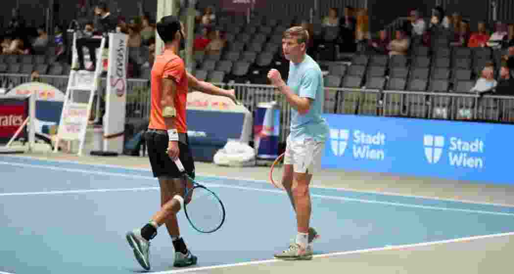 Yuki Bhambri and Andre Göransson celebrate a point during their doubles  match.