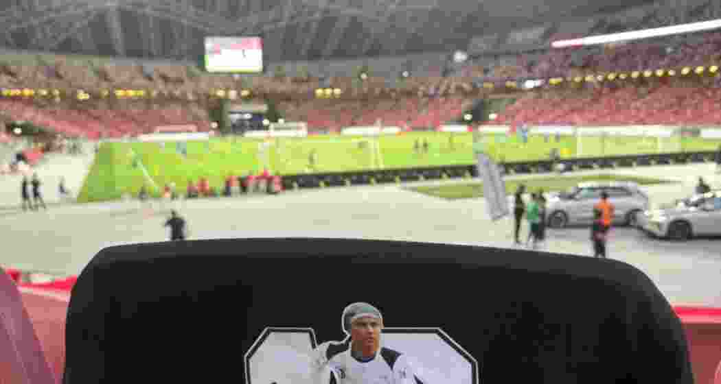 A T-shirt dedicated to Zubeen Garg placed on the seat left vacant at the India-Singapore match.
