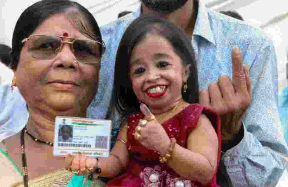 Jyoti Amge, recognized by Guinness World Records as the world's shortest woman, exercised her right to vote at a polling booth in Nagpur. Jyoti Amge, recognized by Guinness World Records as the world's shortest woman, exercised her right to vote at a polling booth in Nagpur.