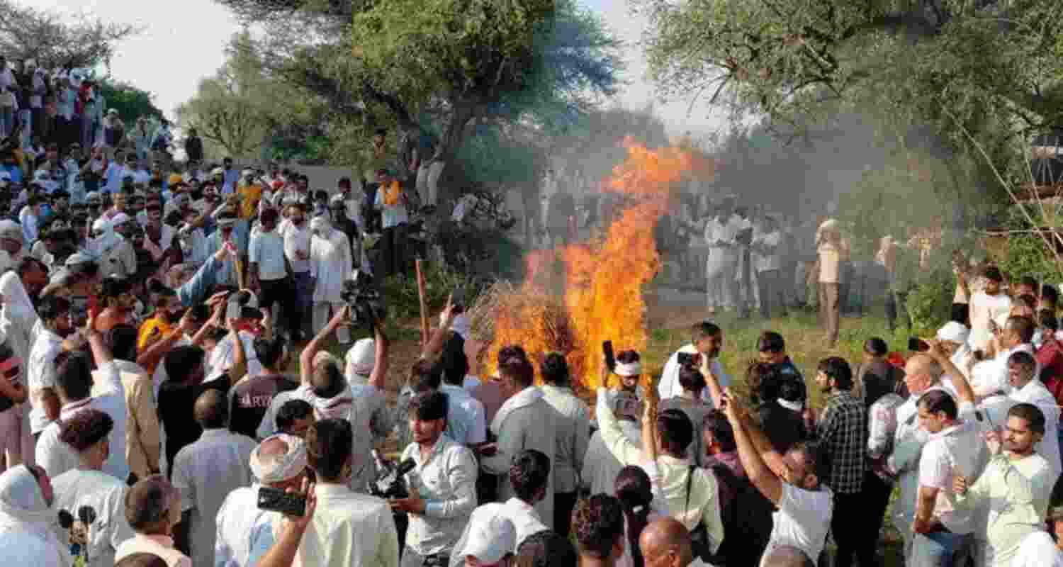 A large crowd gathers to attend the last rites of schoolteacher Manisha in Bhiwani on Thursday. A large crowd gathers to attend the last rites of schoolteacher Manisha in Bhiwani on Thursday.