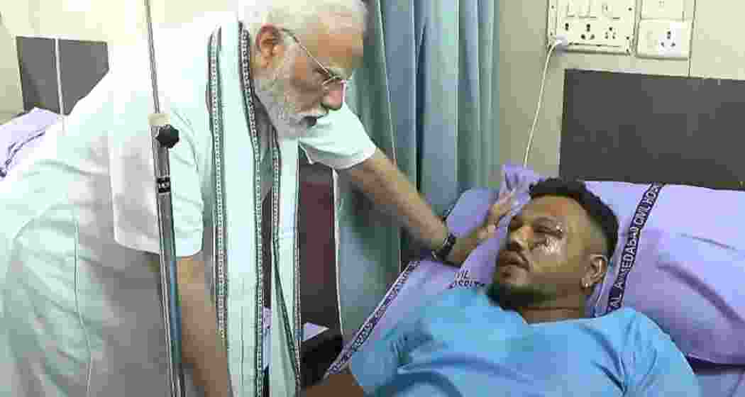 Prime Minister Narendra Modi meets Vishwas Kumar Ramesh, the lone survivor of the Ahmedabad plane crash, at the Civil Hospital to enquire about his health and recovery progress. Prime Minister Narendra Modi meets Vishwas Kumar Ramesh, the lone survivor of the Ahmedabad plane crash, at the Civil Hospital to enquire about his health and recovery progress.