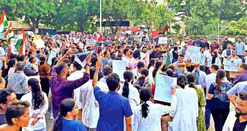 Students protest against the alleged rape and murder of a trainee doctor at Kolkata's RG Kar Medical College and Hospital. Students protest against the alleged rape and murder of a trainee doctor at Kolkata's RG Kar Medical College and Hospital.