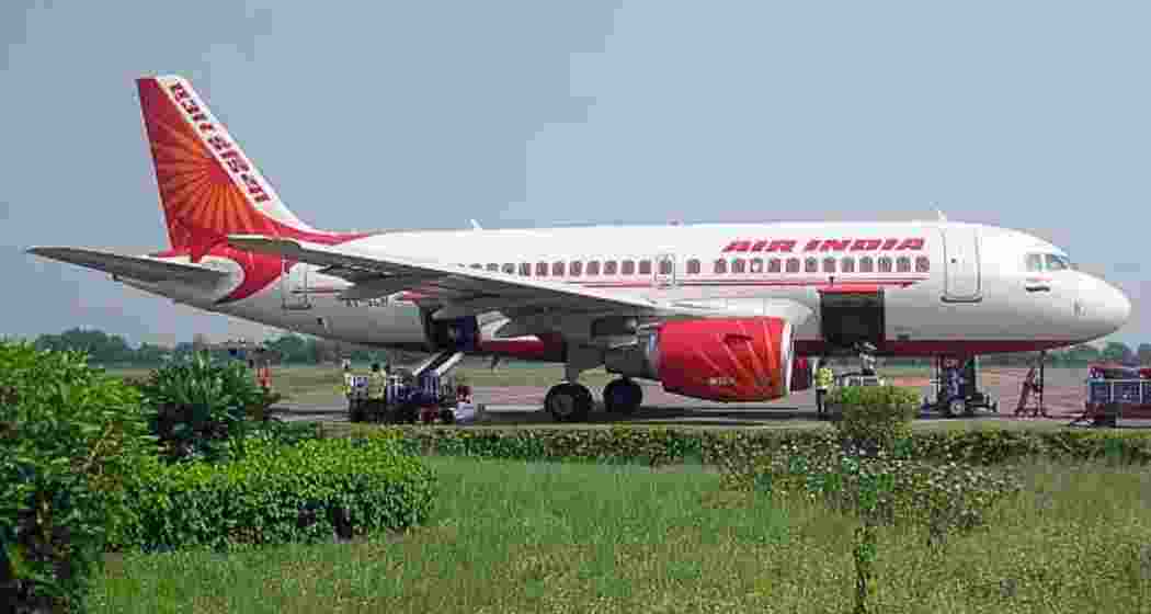 Security personnel inspect an Air India aircraft at IGI Airport, Delhi Security personnel inspect an Air India aircraft at IGI Airport, Delhi
