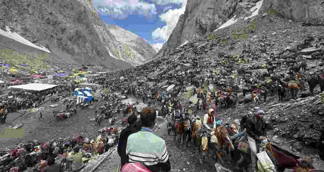 Pilgrims on horseback make their way through the rugged Himalayan terrain towards the sacred Amarnath cave to offer prayers before the naturally formed iced Shivalinga. Pilgrims on horseback make their way through the rugged Himalayan terrain towards the sacred Amarnath cave to offer prayers before the naturally formed iced Shivalinga.