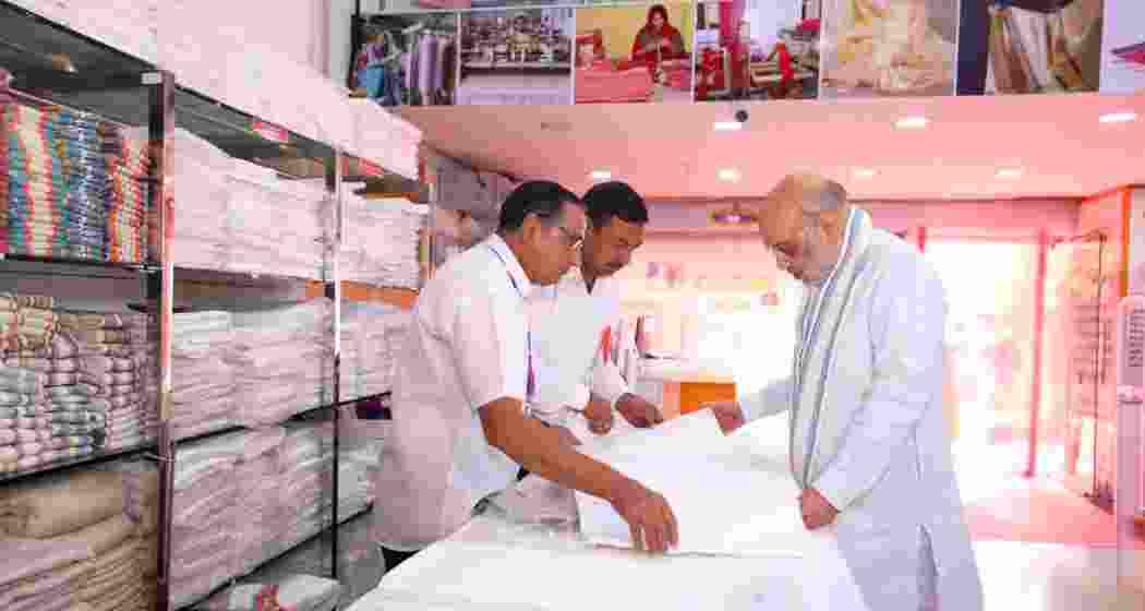 Amit Shah interacts with artisans at the Khadi Karigar Mahotsav in Rohtak on Friday. Amit Shah interacts with artisans at the Khadi Karigar Mahotsav in Rohtak on Friday.
