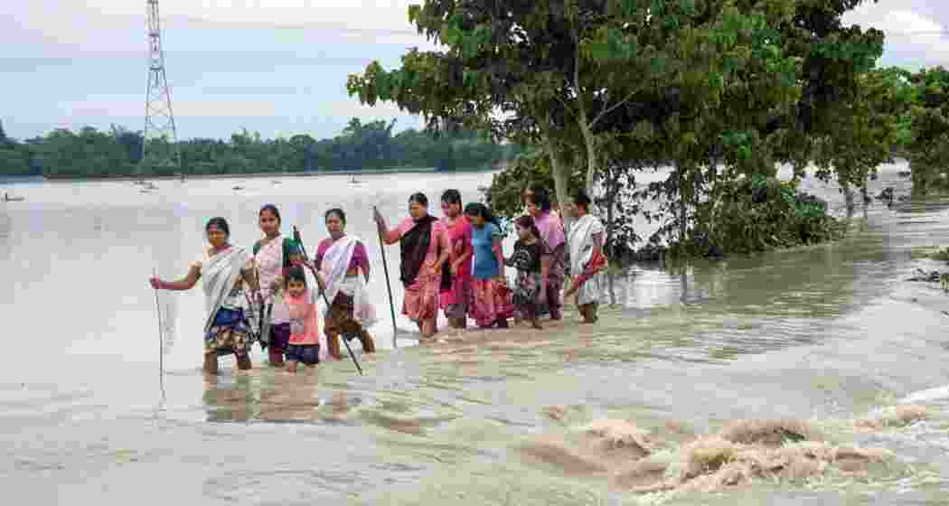 Villagers wade through the flood waters at Dhamdama in Nalbari district of Assam. (File photo) Villagers wade through the flood waters at Dhamdama in Nalbari district of Assam. (File photo)