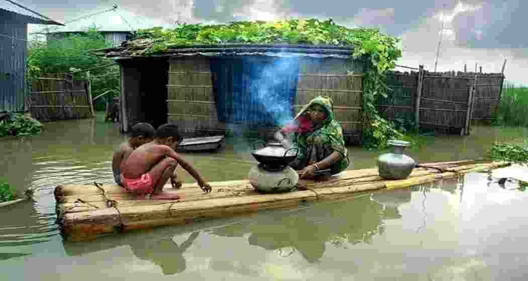 Flood waters wreak havoc in Assam, affecting over 1 lakh people. Flood waters wreak havoc in Assam, affecting over 1 lakh people.