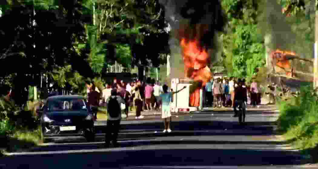 Irked protestors torch a van and hurl stones at police outside Baksa jail during transfer of accused in Zubeen Garg’s death case. Irked protestors torch a van and hurl stones at police outside Baksa jail during transfer of accused in Zubeen Garg’s death case.