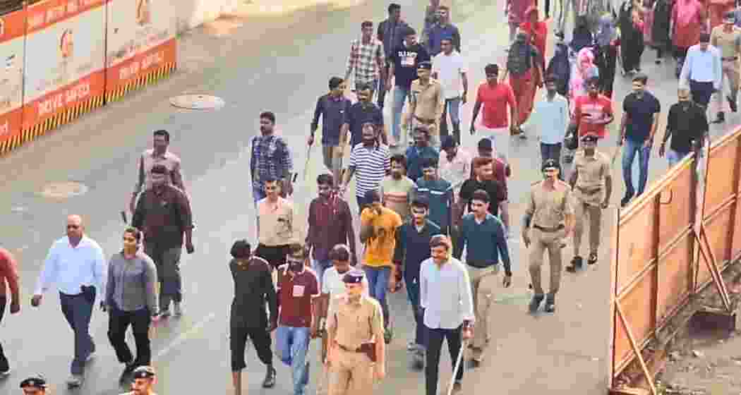 Security forces lead detained illegal immigrants in Gujarat after identifying them through forged identity papers during early morning coordinated raids in urban neighbourhoods on Saturday. Security forces lead detained illegal immigrants in Gujarat after identifying them through forged identity papers during early morning coordinated raids in urban neighbourhoods on Saturday.
