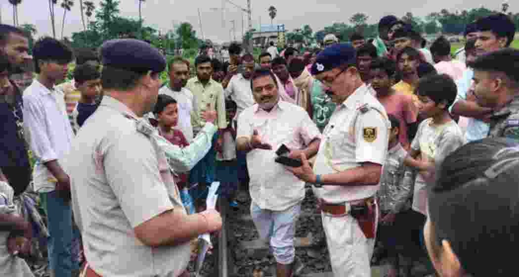 Locals, railway staff and police gather at the accident site in Purnea. Locals, railway staff and police gather at the accident site in Purnea.