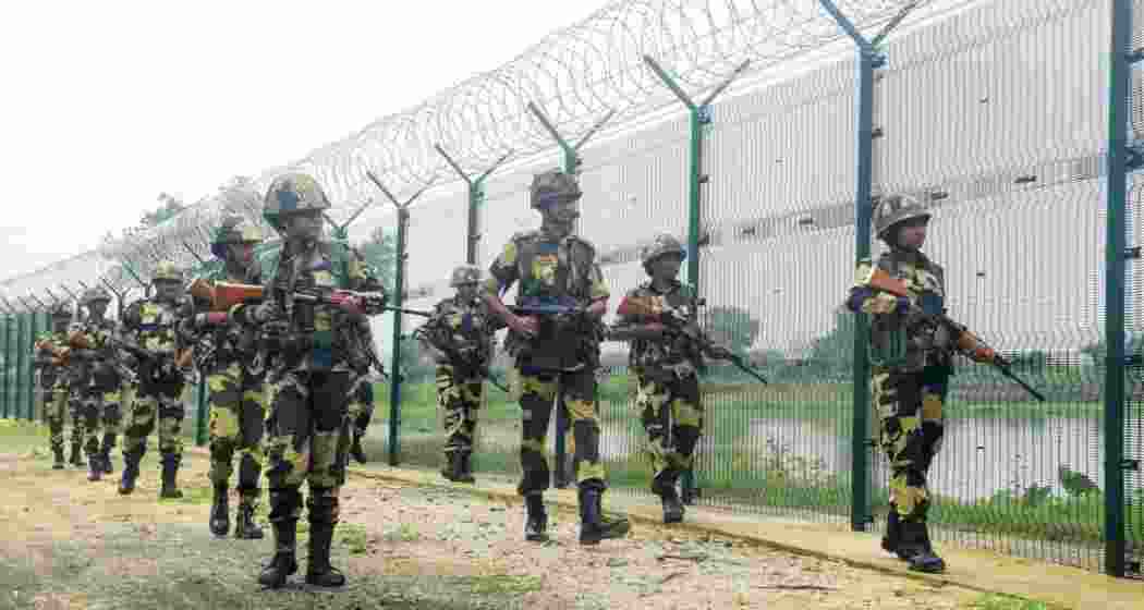 Border Security Force (BSF) personnel keep vigil at the India-Bangladesh border. (PTI) Border Security Force (BSF) personnel keep vigil at the India-Bangladesh border. (PTI)