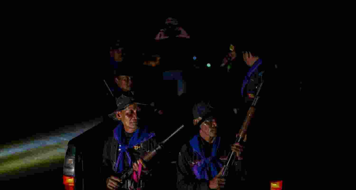 Village security volunteers patrol a village amid deadly clashes between Thailand and Cambodia along a disputed border area, in Buriram province, Thailand. Village security volunteers patrol a village amid deadly clashes between Thailand and Cambodia along a disputed border area, in Buriram province, Thailand.