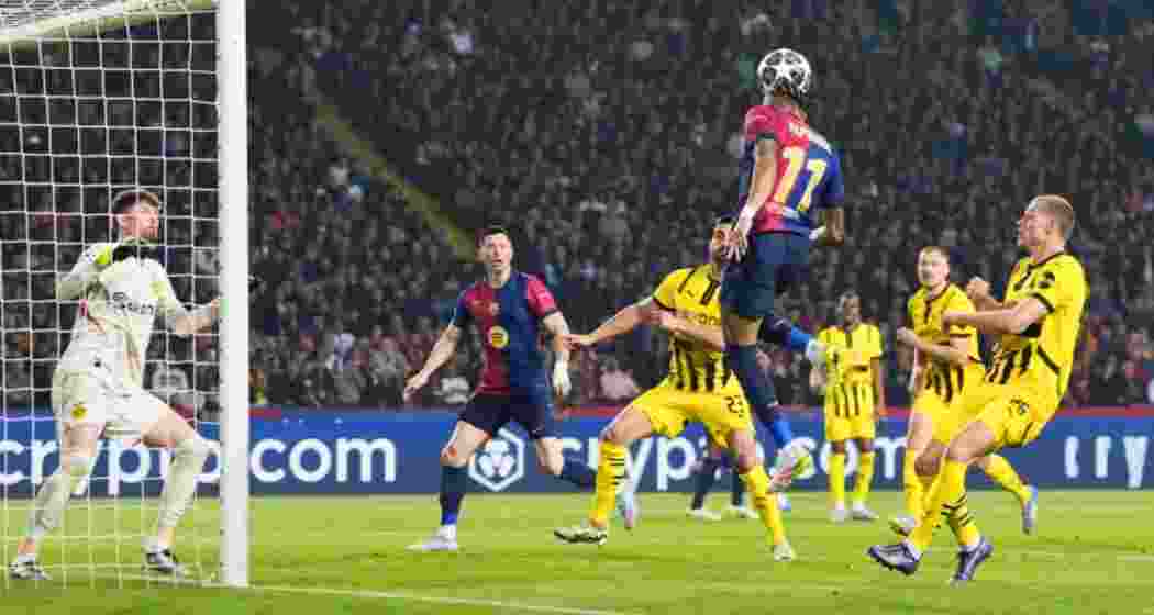 Raphinha of Barcelona heads the ball across the goal before his teammate Robert Lewandowski scores his team’s second goal. Raphinha of Barcelona heads the ball across the goal before his teammate Robert Lewandowski scores his team’s second goal.