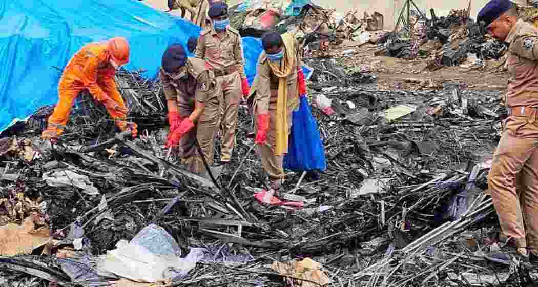 SDRF and Police personnel conduct a search operation at the Air India AI-171 flight crash site, in Ahmedabad. Photograph: @dgpgujarat/X SDRF and Police personnel conduct a search operation at the Air India AI-171 flight crash site, in Ahmedabad. Photograph: @dgpgujarat/X