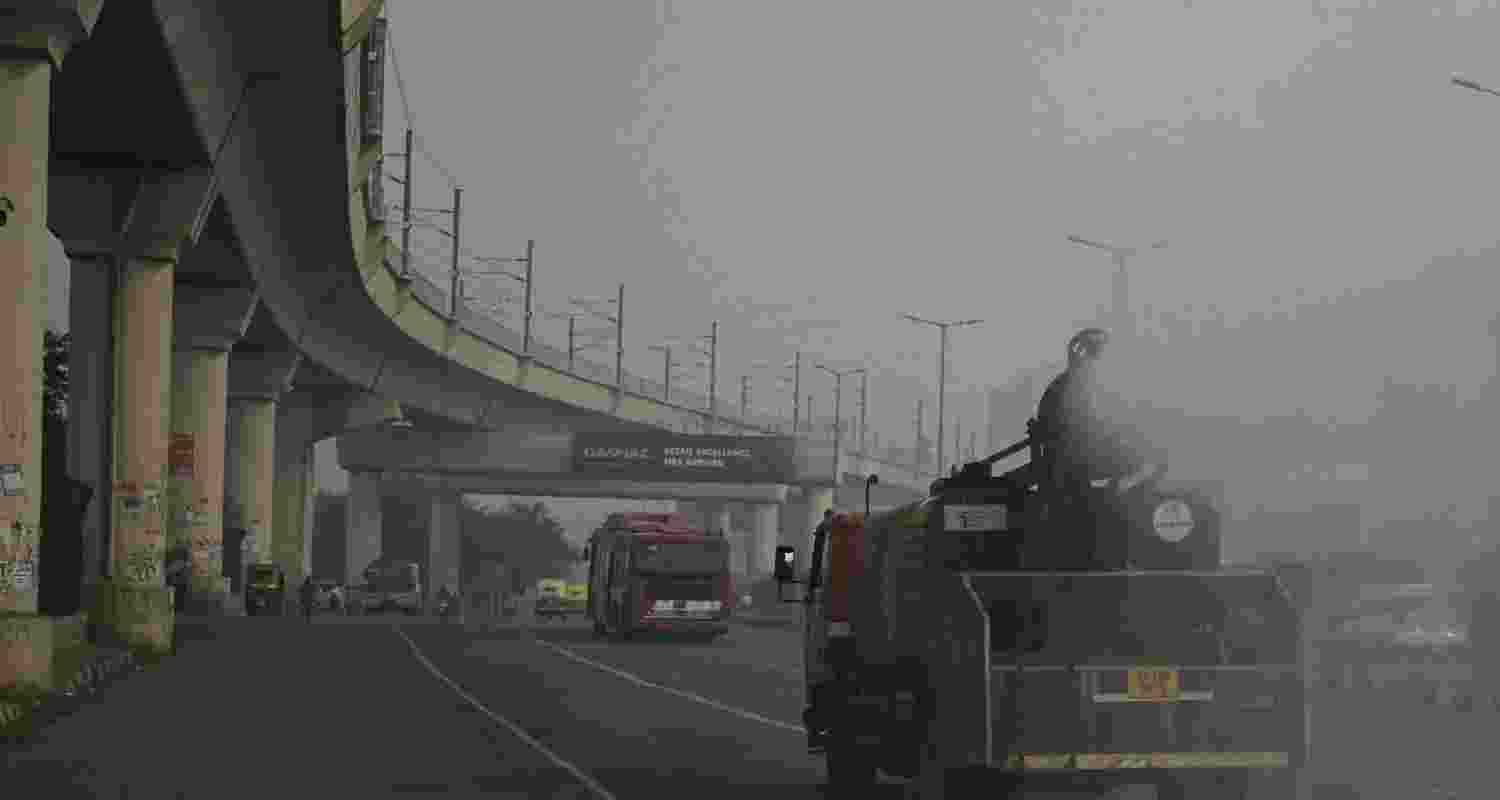 A view of an anti smog gun spraying water to settle down dust. A view of an anti smog gun spraying water to settle down dust.