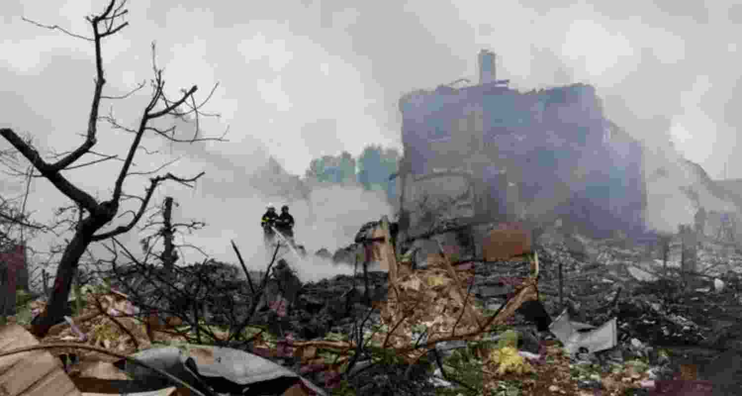 Emergency workers extinguish fire in the debris of a private house that was destroyed in a Russian rocket strike, amid Russia's attack on Ukraine, in Markhalivka, Kyiv region, Ukraine. Emergency workers extinguish fire in the debris of a private house that was destroyed in a Russian rocket strike, amid Russia's attack on Ukraine, in Markhalivka, Kyiv region, Ukraine.