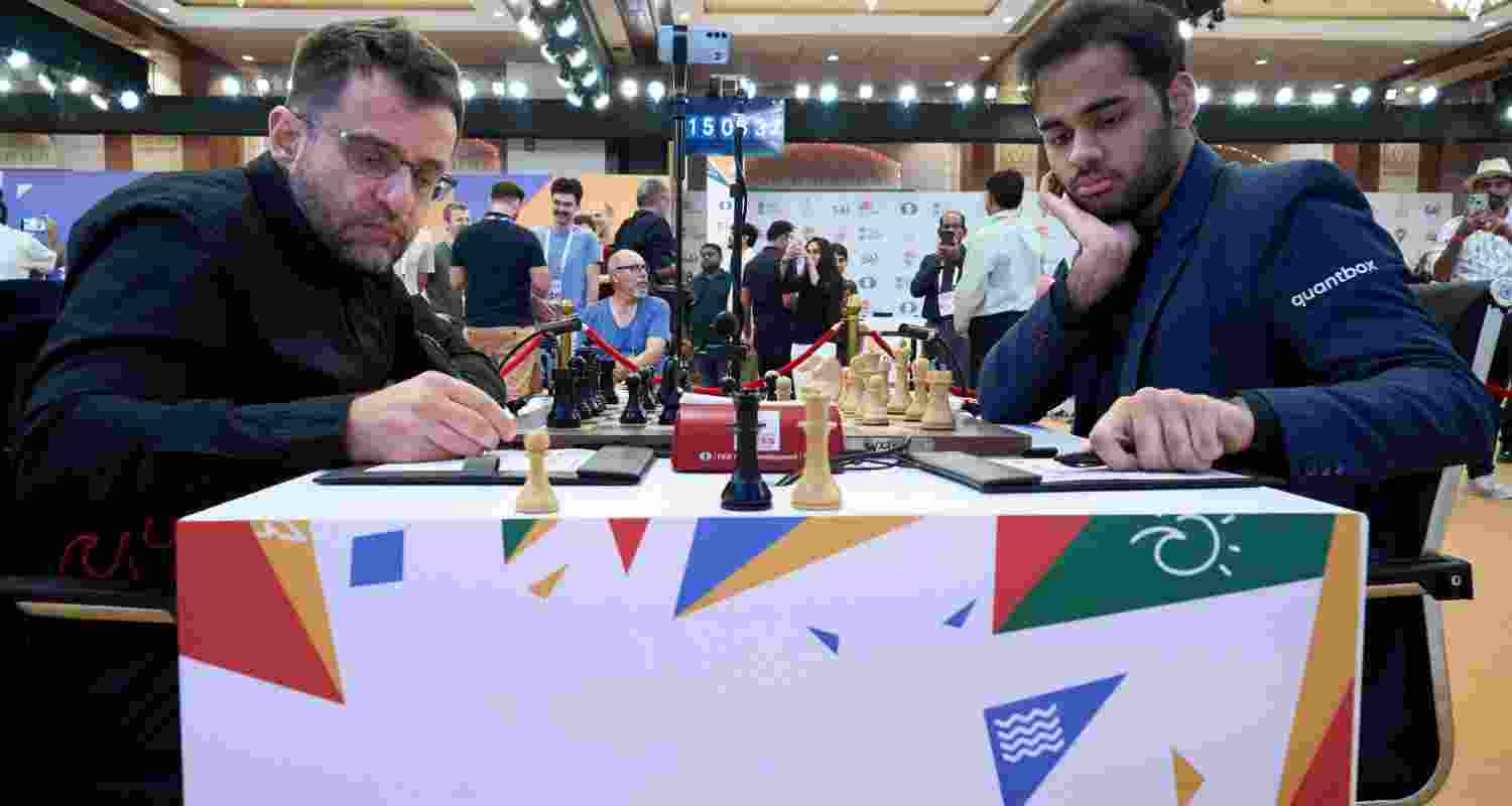 Arjun Erigaisi and Levon Aronian in action during their Round 5 Game 1 at FIDE World Cup in Panaji on Friday. Arjun Erigaisi and Levon Aronian in action during their Round 5 Game 1 at FIDE World Cup in Panaji on Friday.