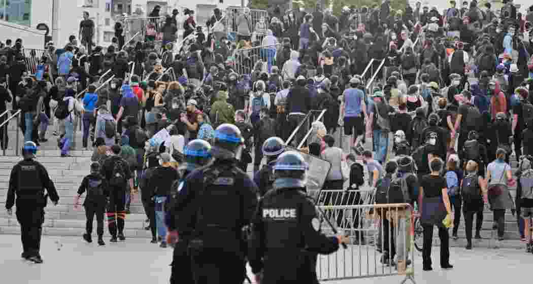 Protesters have blocked roads, set blazes and were met with volleys of police tear gas in Paris and elsewhere in France. Protesters have blocked roads, set blazes and were met with volleys of police tear gas in Paris and elsewhere in France.