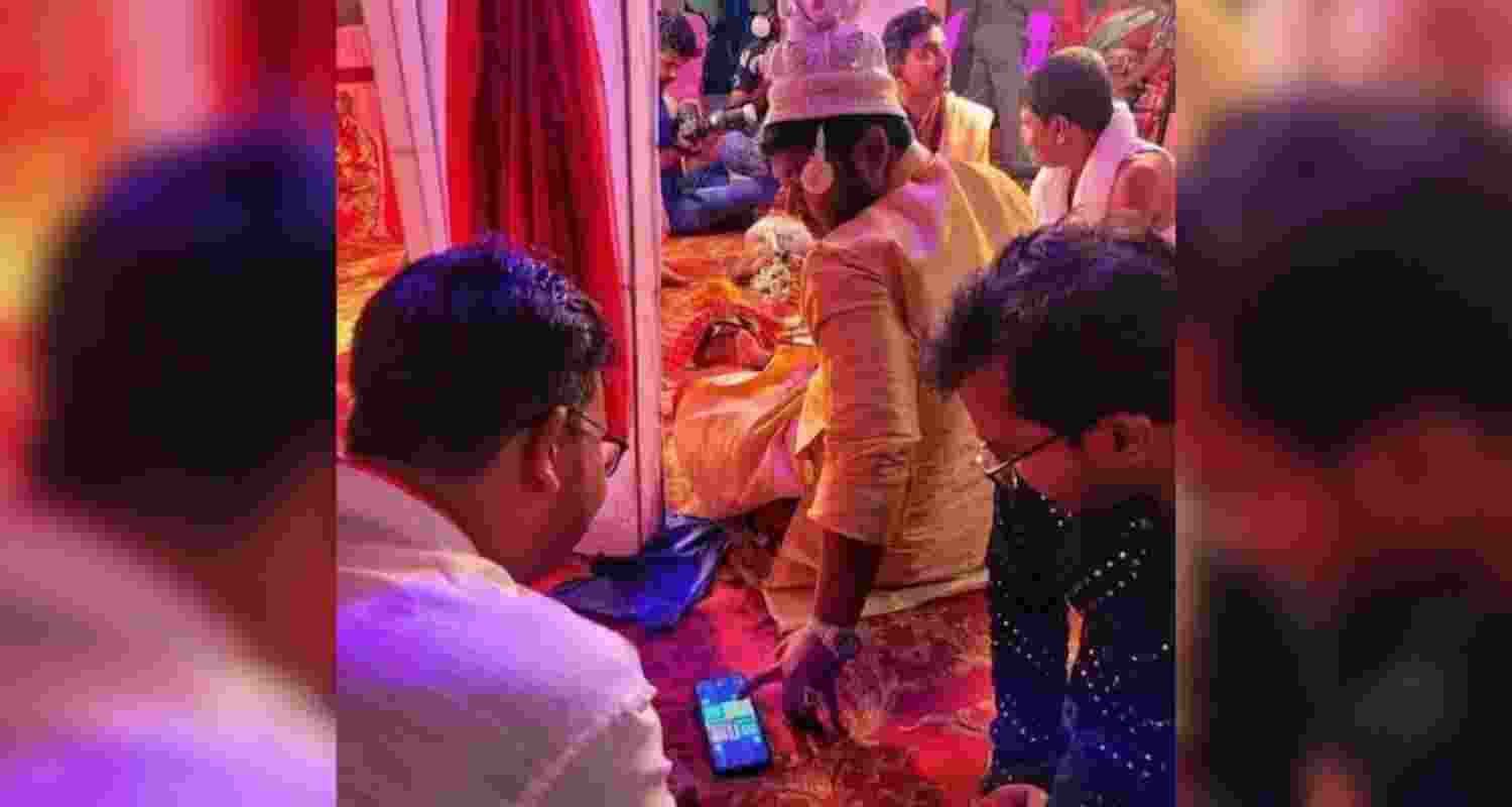 The groom playing ludo during the wedding. The groom playing ludo during the wedding.