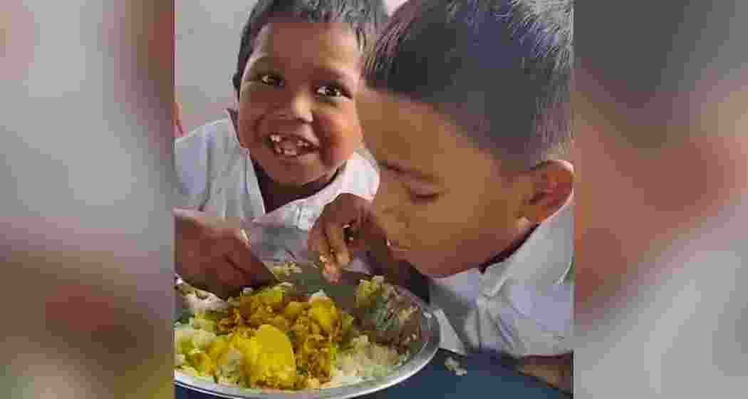 Soleman Sheikh and Sandeep Saha of Malda’s Olitola Primary School share a mid-day meal. Soleman Sheikh and Sandeep Saha of Malda’s Olitola Primary School share a mid-day meal.