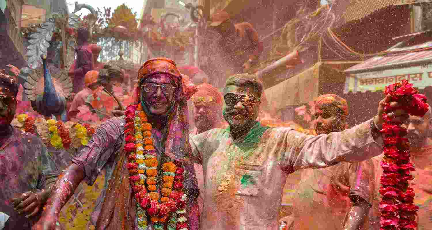 People play with colours ahead of the festival of Holi, in Agra People play with colours ahead of the festival of Holi, in Agra