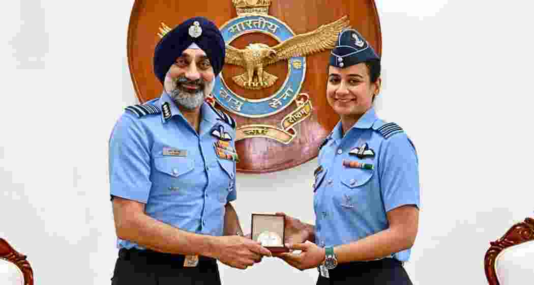 Indian Air Force Chief Air Chief Marshal A P Singh felicitates Saanya after she became the first woman officer in the Indian Air Force to earn the prestigious Cat-A Qualified Flying Instructor (QFI) qualification, during a ceremony recognising excellence in military aviation training and instructional capability. Indian Air Force Chief Air Chief Marshal A P Singh felicitates Saanya after she became the first woman officer in the Indian Air Force to earn the prestigious Cat-A Qualified Flying Instructor (QFI) qualification, during a ceremony recognising excellence in military aviation training and instructional capability.